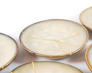 Small Beige Kintsugi Plate Adorned in 22K Gold