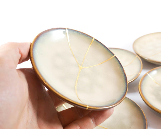 Small Beige Kintsugi Plate Adorned in 22K Gold