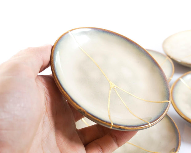 Small Beige Kintsugi Plate Adorned in 22K Gold