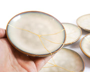 Small Beige Kintsugi Plate Adorned in 22K Gold