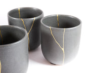 Elegant Grey Ceramic Cup with Gold Kintsugi