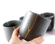 Elegant Grey Ceramic Cup with Gold Kintsugi